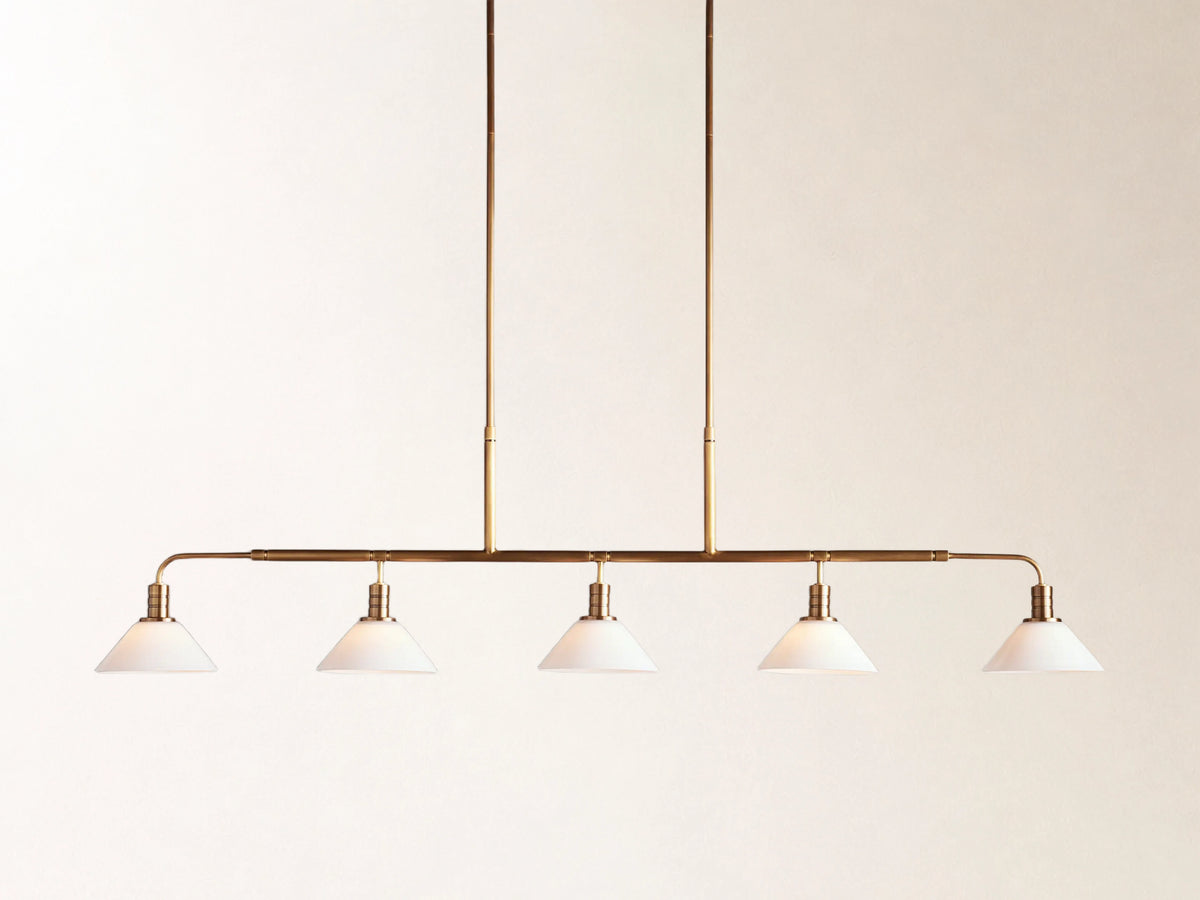 Theron 60" Linear Chandelier with Milk Glass in Brass Main image
