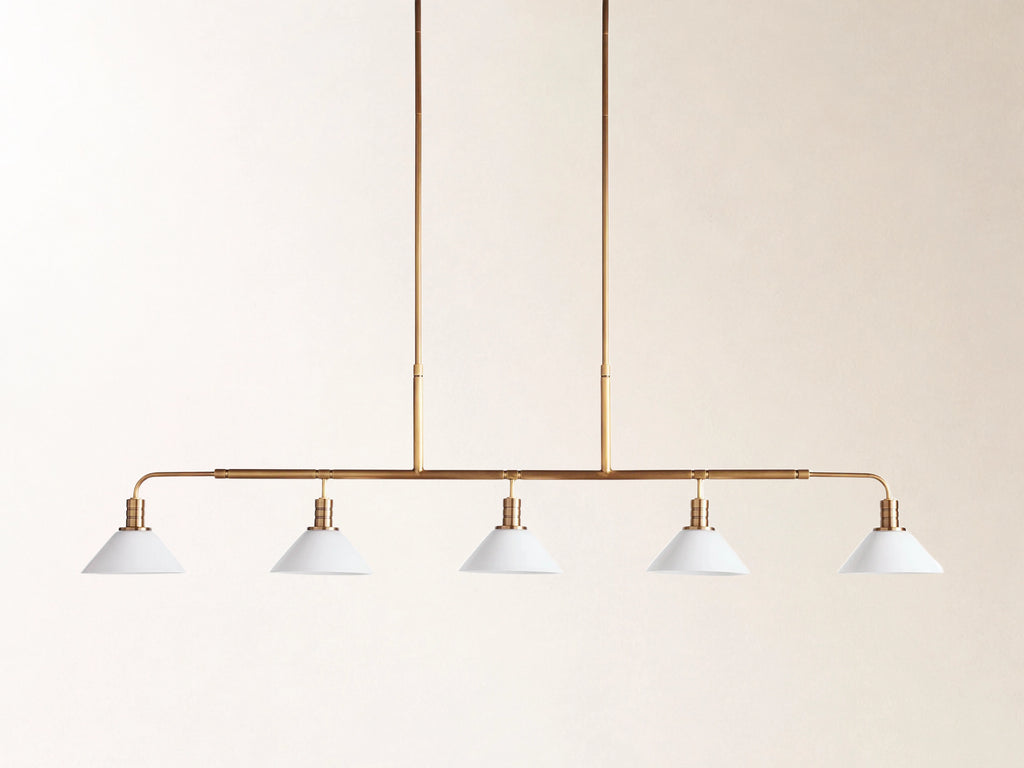 Theron 60" Linear Chandelier with Milk Glass in Brass