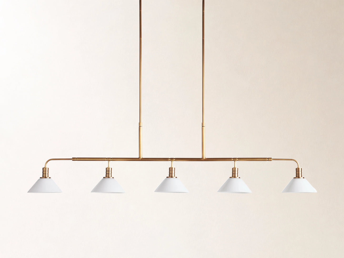 Theron 60" Linear Chandelier with Milk Glass in Brass