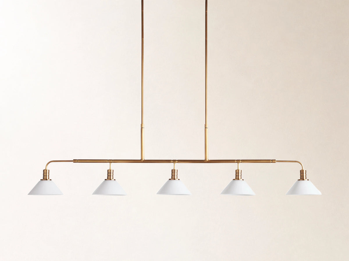 Theron 60" Linear Chandelier with Milk Glass in Brass